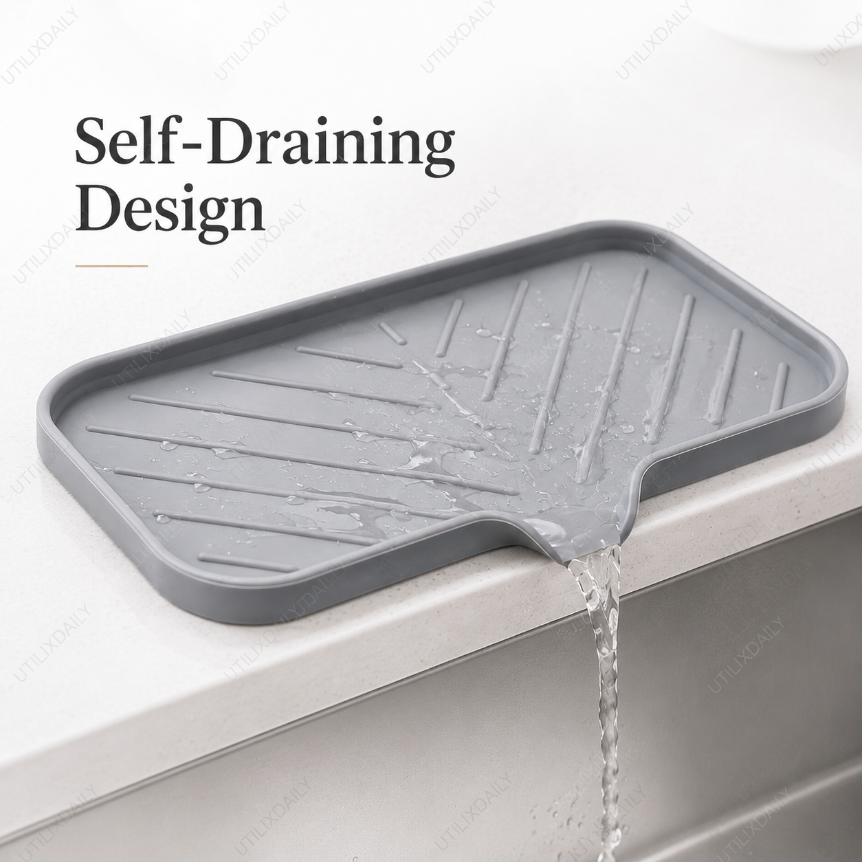 Close-up of the grey silicone sink tray showing its draining grooves and front spout for water runoff.