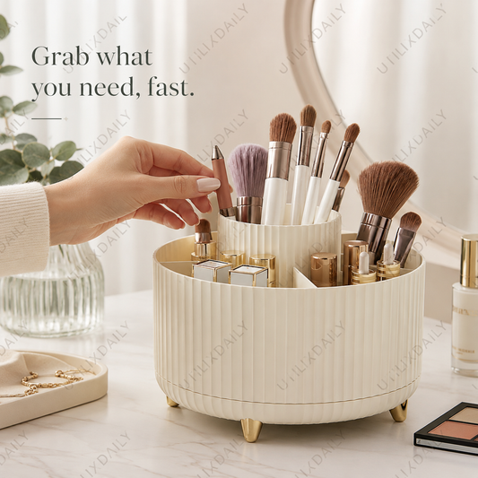 A feminine hand reaching into an ivory rotating makeup organizer to grab a makeup brush from a tidy vanity setup.