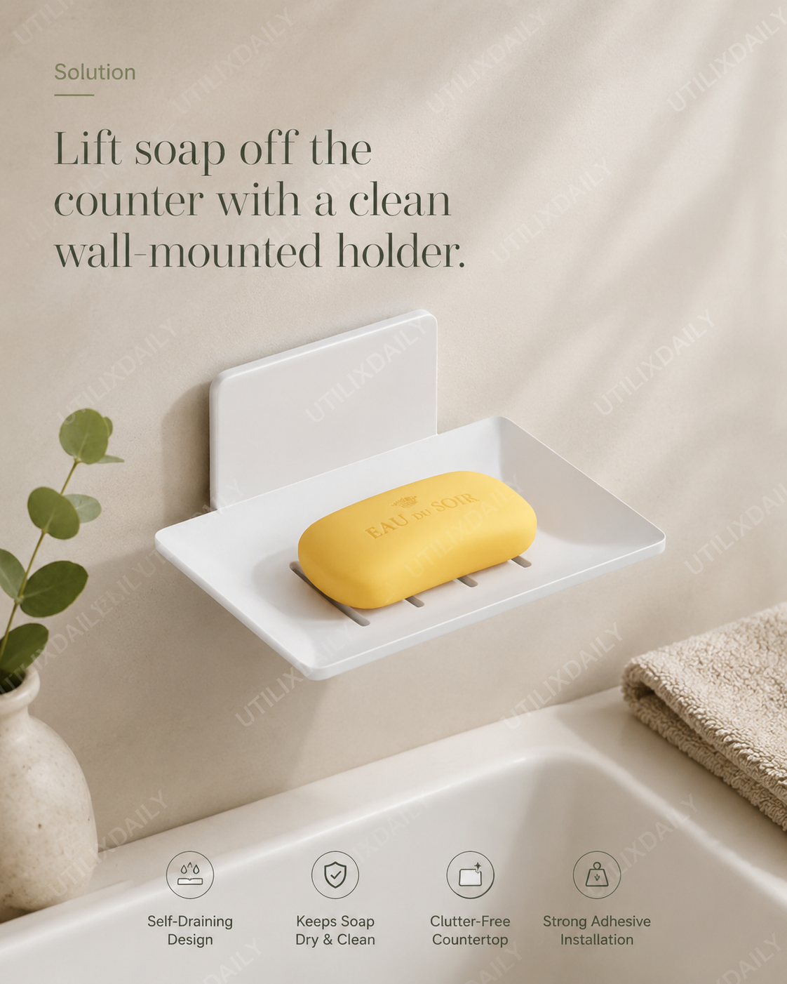 Promotional image of a white wall-mounted soap holder keeping a soap bar dry and off the counter.